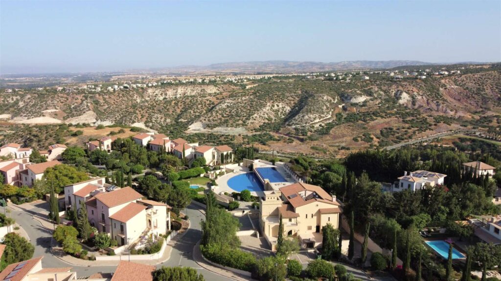 View of Apollo Heights Village communal pool on Aphrodite Hills Resort, Cyprus, with sea views.