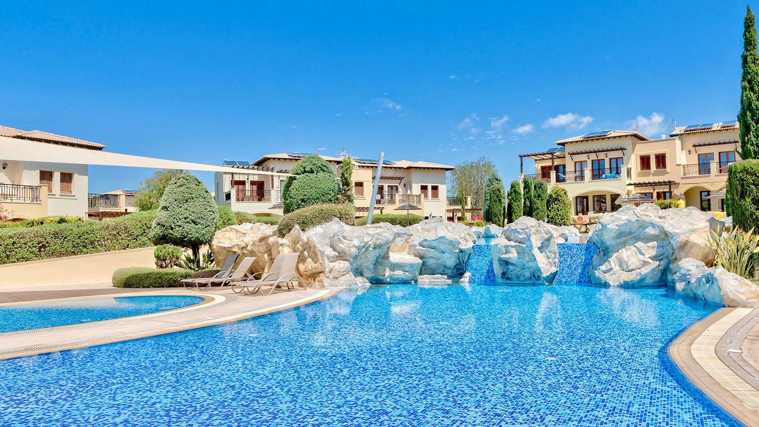 View of Theseus Village communal pool on Aphrodite Hills Resort