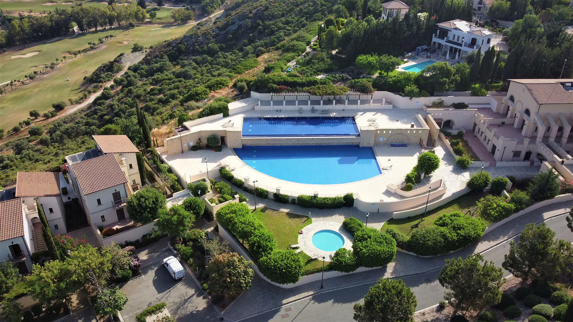Thumbnail of YouTube video for Apollo Heights Village communal village on Aphrodite Hills Resort. Two images with title text.