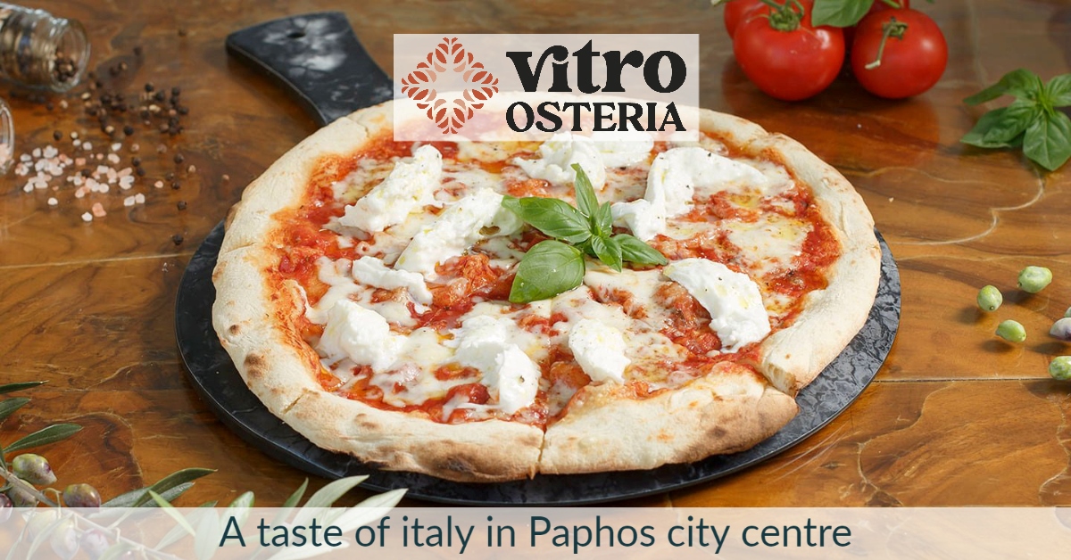 Photograph of a homemade pizza on a pizza slate, with 'vitro osteria' restaurant logo over the top, and text 'a taste of italy in paphos city centre'
