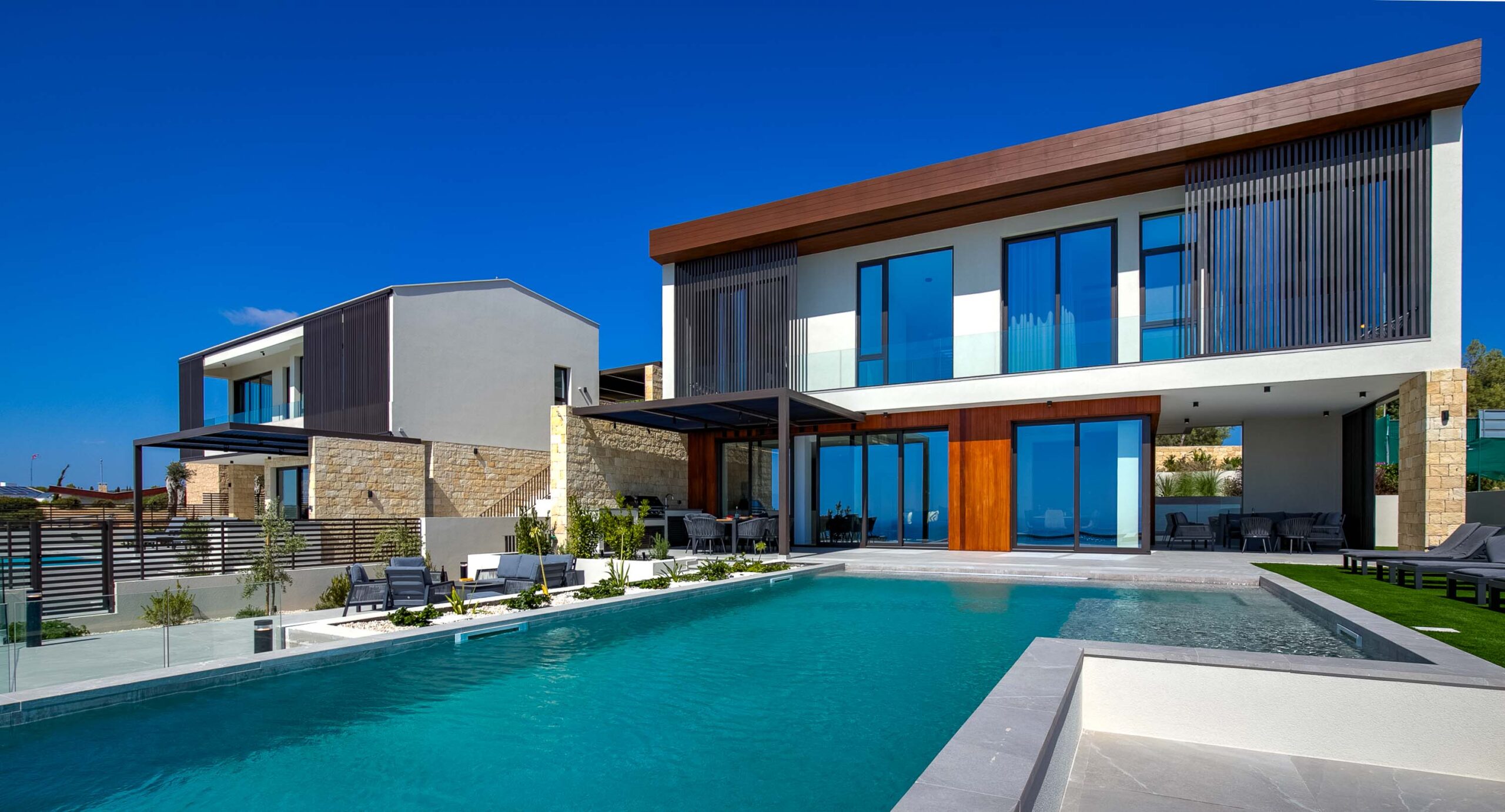 Photo of Villa 286 on Aphrodite Hills - front facing showing pool and outside terrace