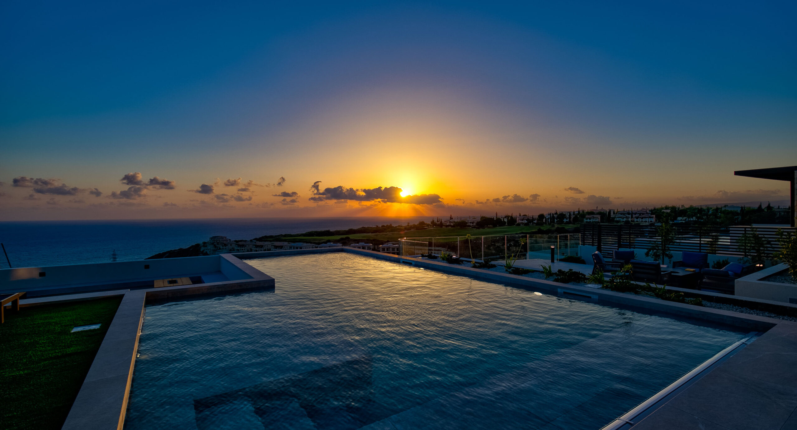 Photo of Villa 286 on Aphrodite Hills - Pool looking out to sea with sunset in the background